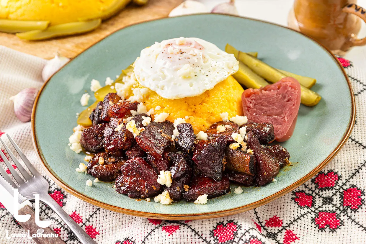 Moldavian pork stew with polenta, cheese and egg