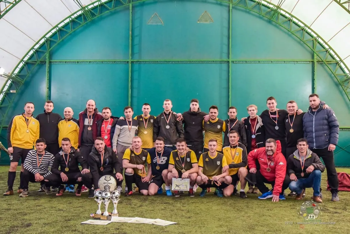 Football teams on the Greenfield covered pitch after a tournament
